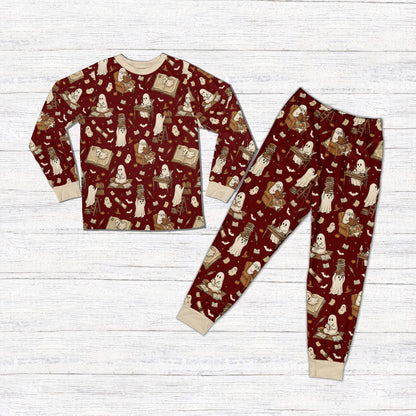 Matching family holiday pajamas with red background and Halloween ghosts, front view