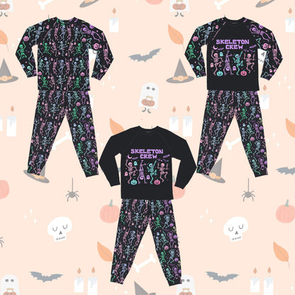 Close-up of the colorful dancing skeletons and ghosts print on black polyester fabric