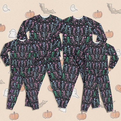 Matching family pajama set with Halloween skeletons and ghosts design on black background, front view