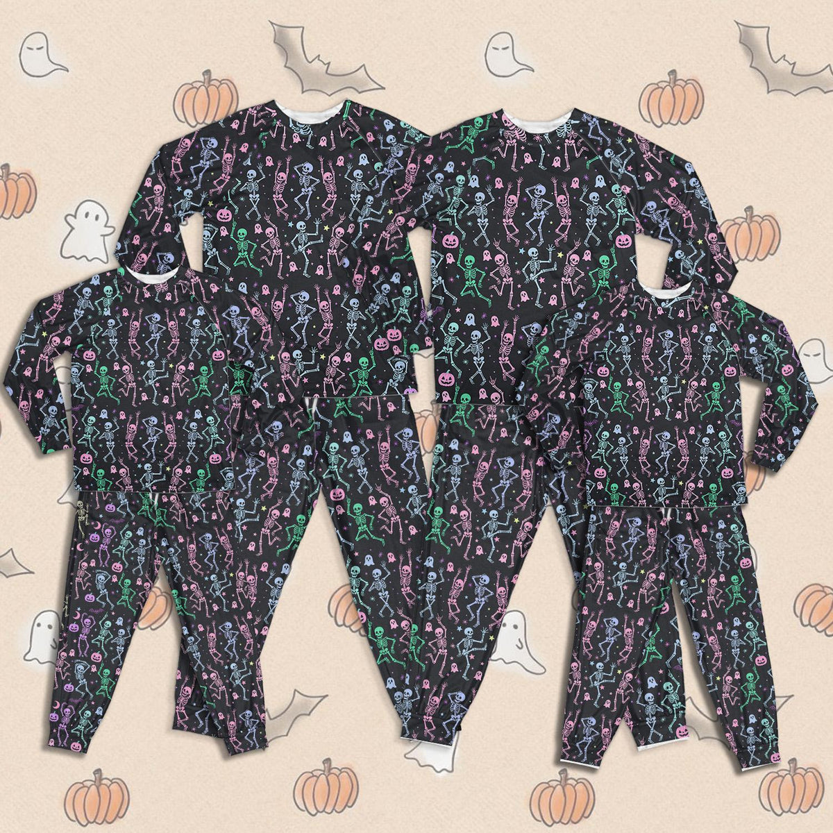 Matching family pajama set with Halloween skeletons and ghosts design on black background, main view