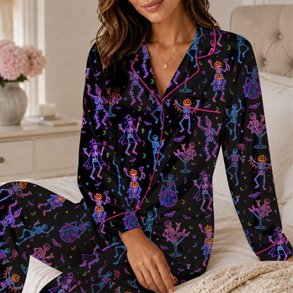 Another front view of the black pajama set with neon pink, blue, and purple skeletons