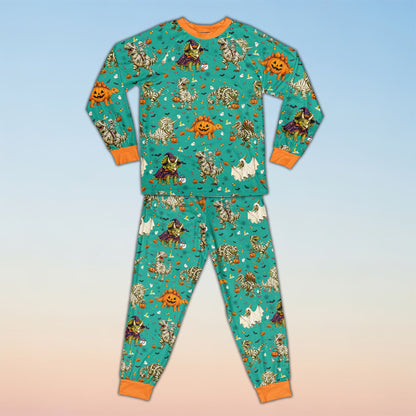 Front view of personalized teal Halloween dinosaur pajama set