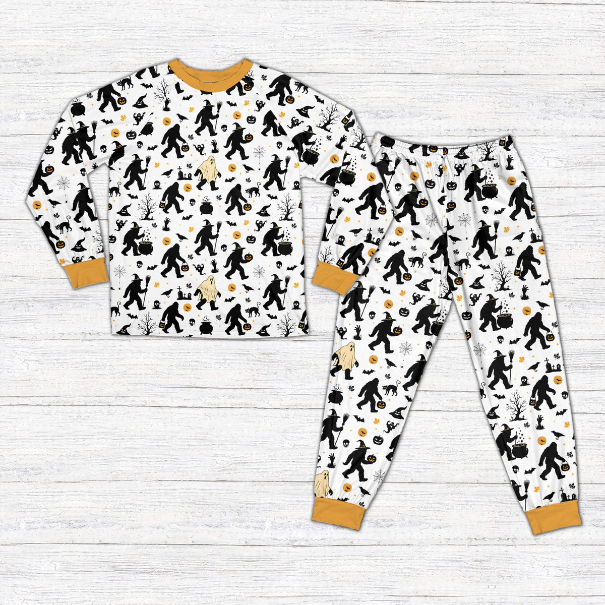 White Halloween pajama set with Bigfoot and spooky patterns on matching family members