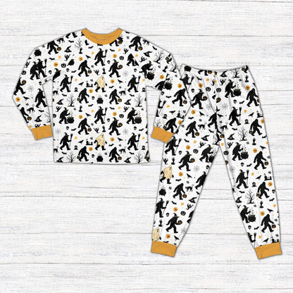 White Halloween pajama set with Bigfoot and spooky patterns on matching family members