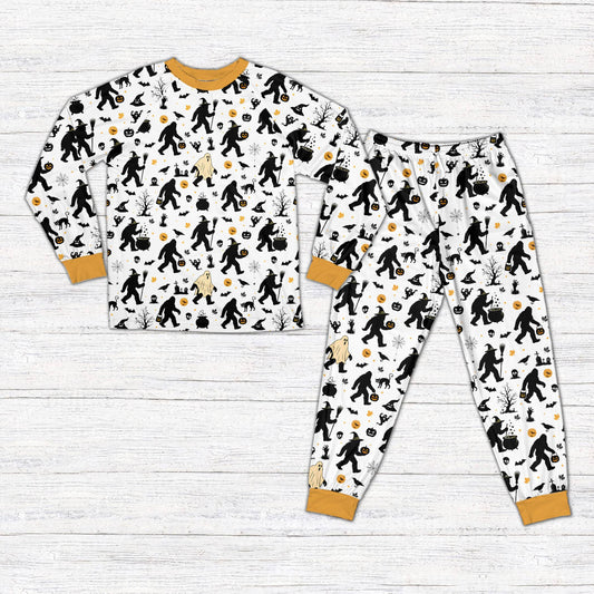 White Halloween pajama set with Bigfoot and spooky patterns on matching family members