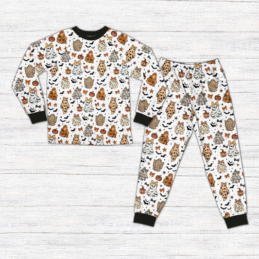 White halloween pajama set featuring leopard print ghosts and jack-o'-lanterns, front view