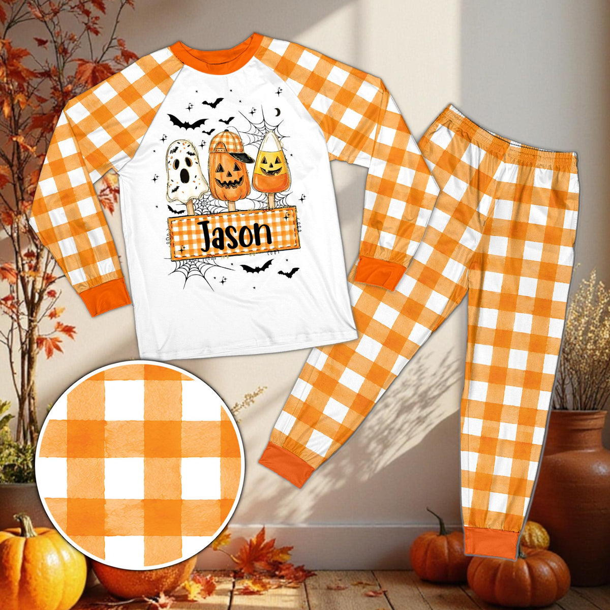Front view of the personalized Halloween pajama set with orange and white plaid