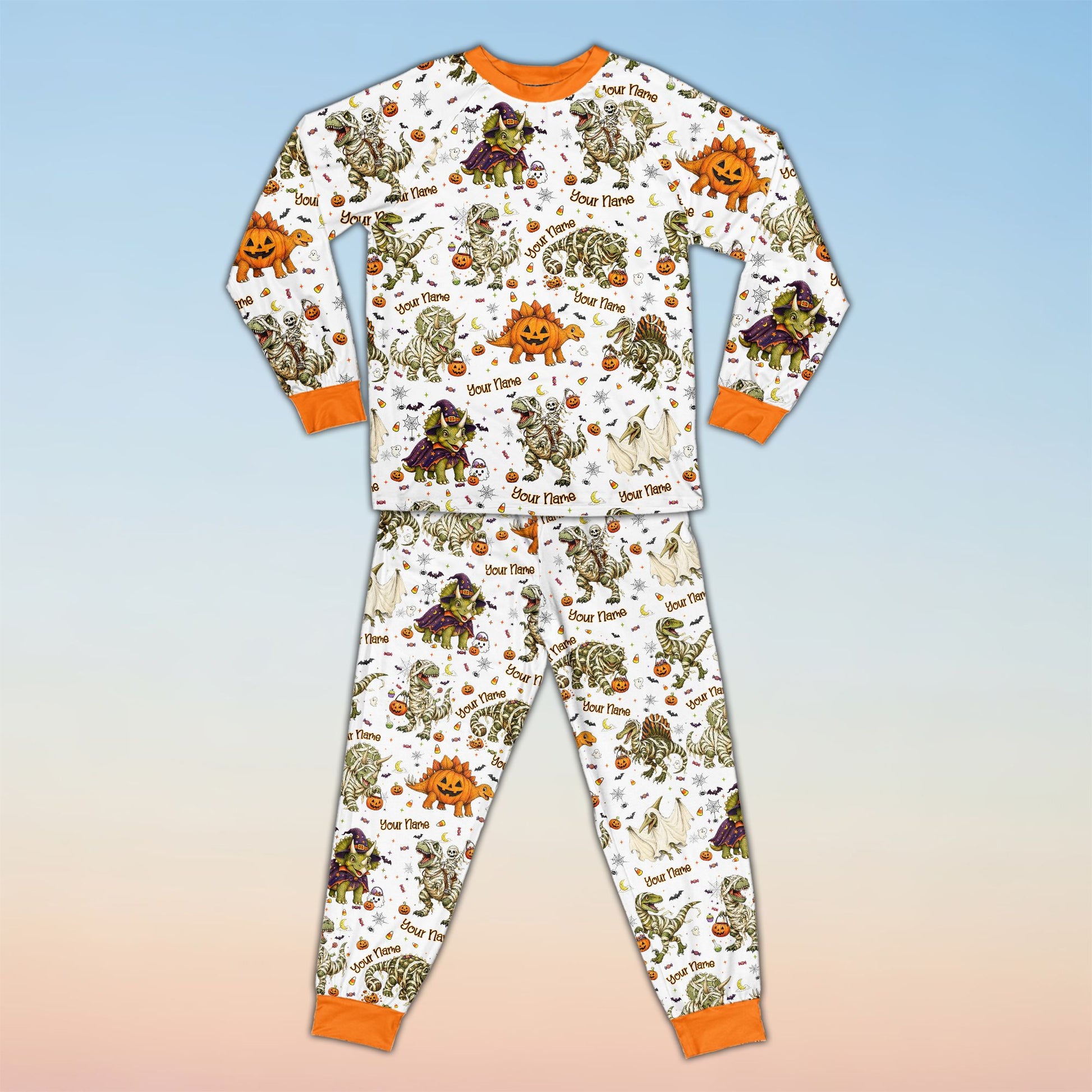Family wearing matching family pajamas holiday sets with Halloween dinosaur design