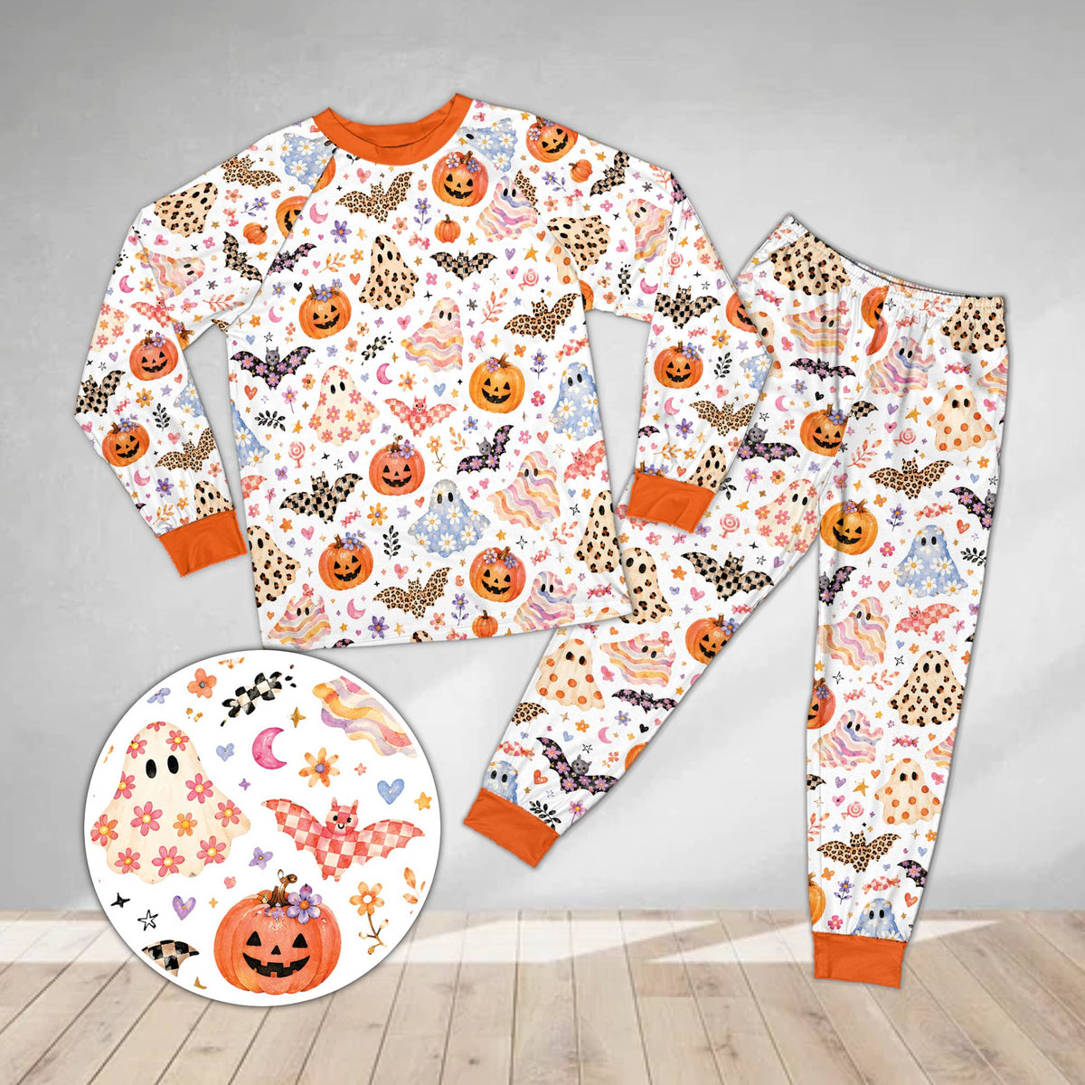 White halloween pajama set with whimsical jack-o'-lanterns and stars, front view