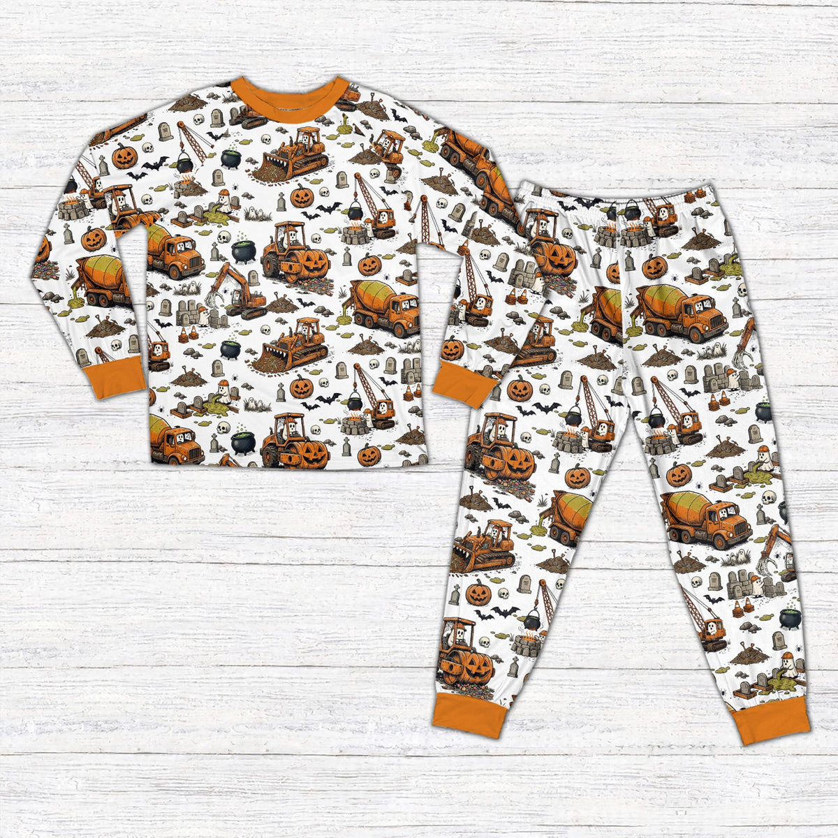 Personalized Halloween pajama set with construction vehicles and custom name, main view in white