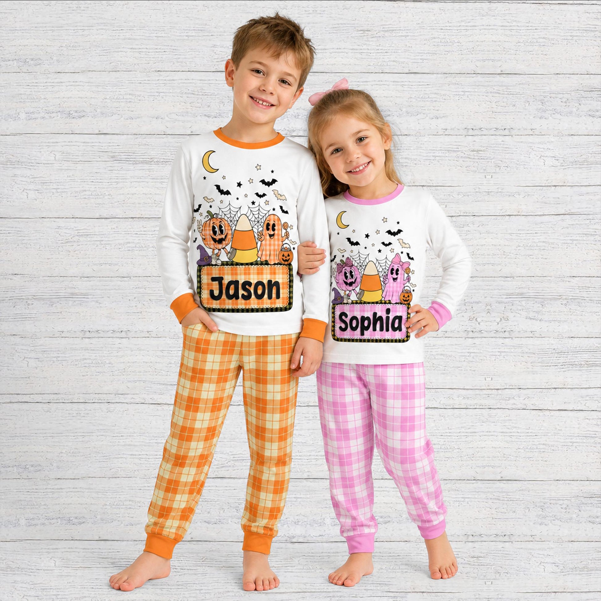 Lifestyle view of family wearing the family matching halloween pajamas in white