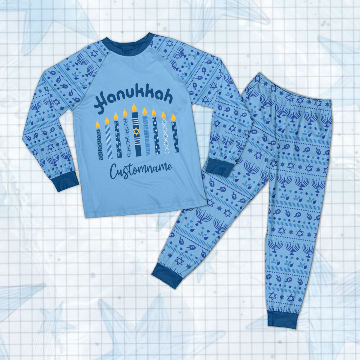Family wearing custom hanukkah pajama set with lit candles design and blue menorah pattern pants.