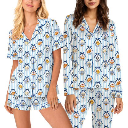 Close up of hanukkah pajama set pattern featuring menorahs and dreidels