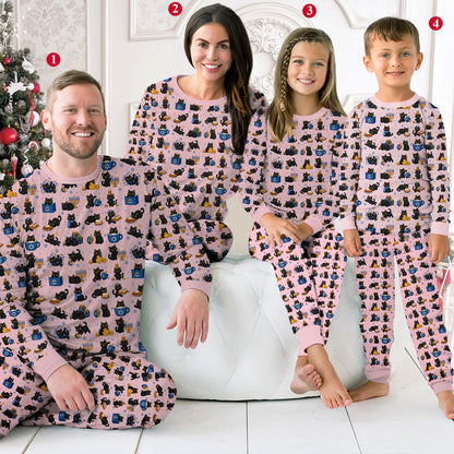 Person sitting in the holiday matching pajamas family