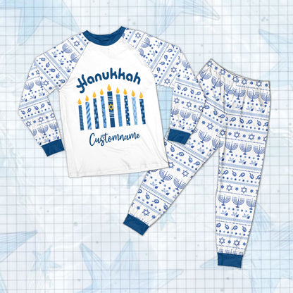 Close up of the Hanukkah arched candle design on the pajama set top.