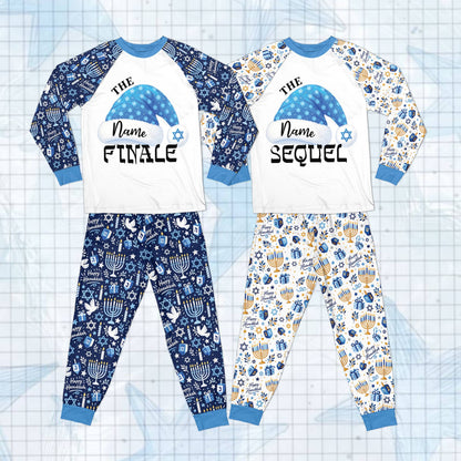 Hanukkah pattern pajama pants showcasing menorahs, dreidels, and stars in blue and gold