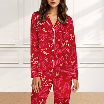 Matching family pajamas in red with all-over love script pattern, front view of the pajama set