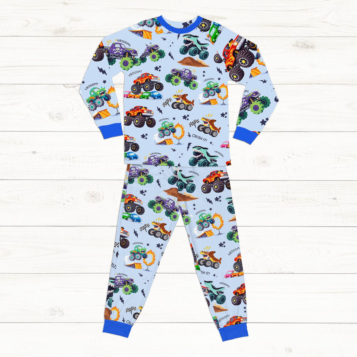 Blue monster trucks pajama set detailed front view
