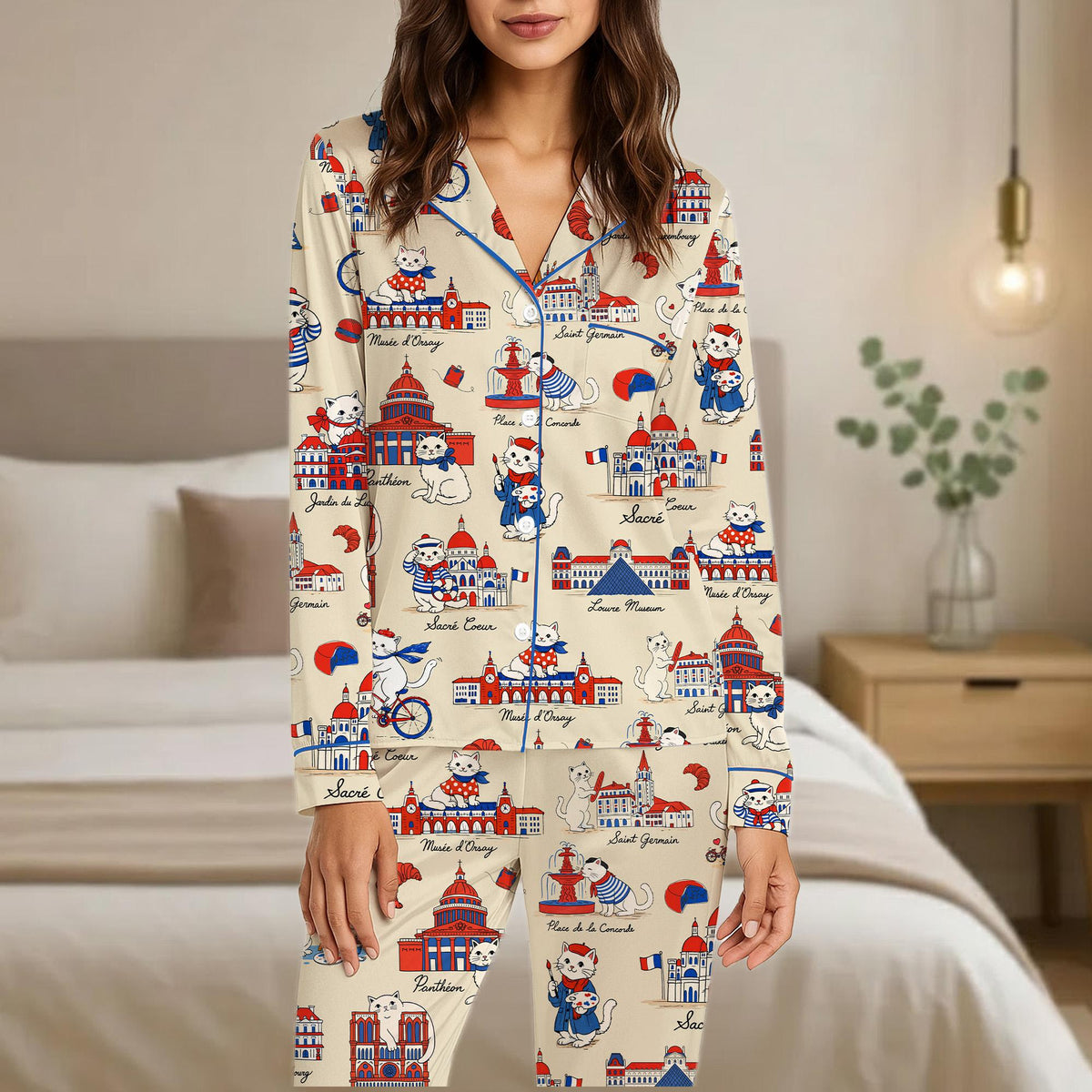 Relaxing at home wearing the beige Paris cats pajama set