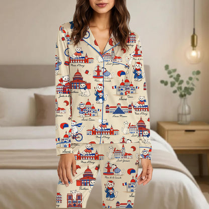 Relaxing at home wearing the beige Paris cats pajama set