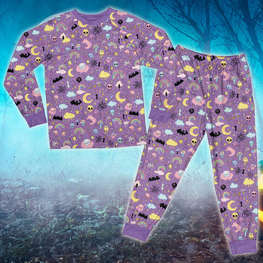 Pastel goth Halloween family pajamas matching set featuring bats and moons in pink and purple