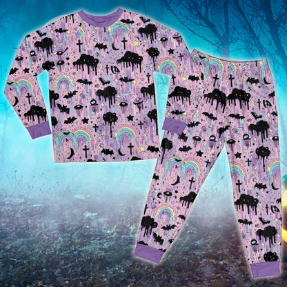 Front close-up of the pastel goth Halloween matching family pajamas showing vibrant prints