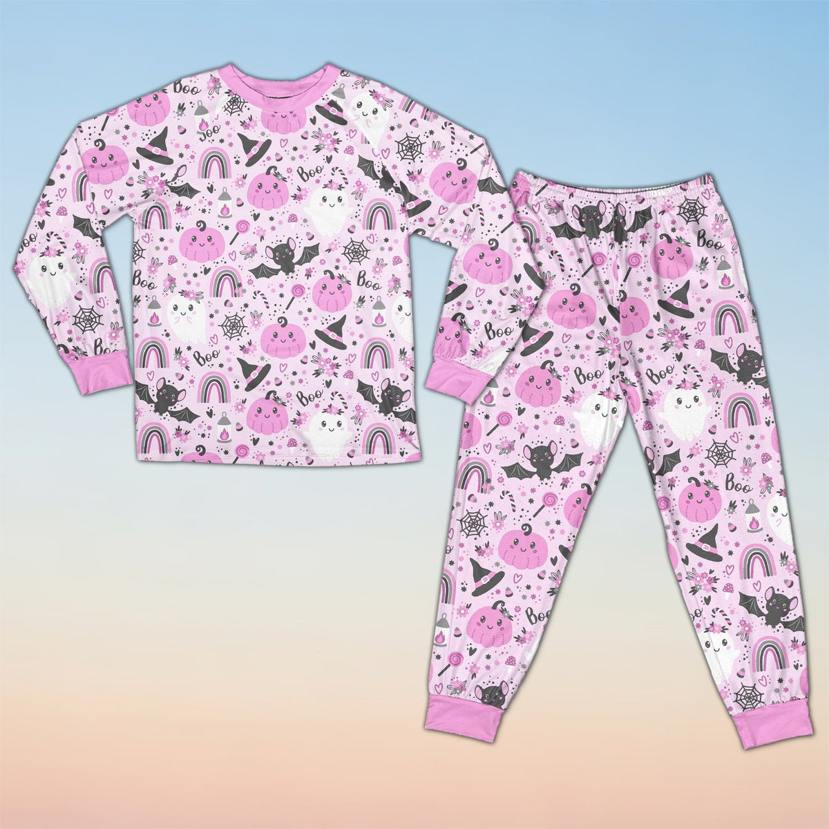 Front view of the pink halloween pajama set featuring pastel ghosts and pumpkins