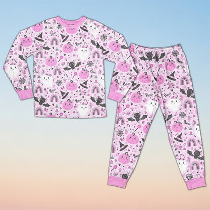 Front view of the pink halloween pajama set featuring pastel ghosts and pumpkins