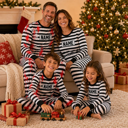 Lifestyle shot of the matching family prisoner pajama set showing the striped Halloween design