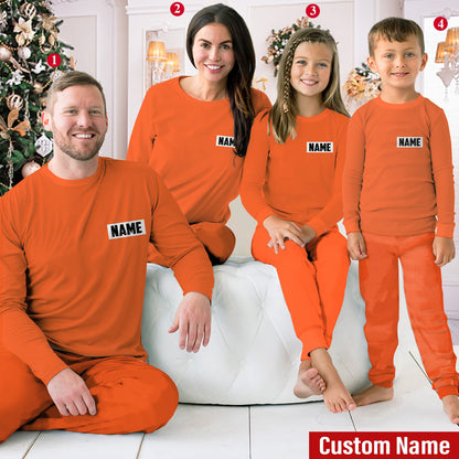 Another lifestyle image of a family having fun in their matching prisoner pajamas