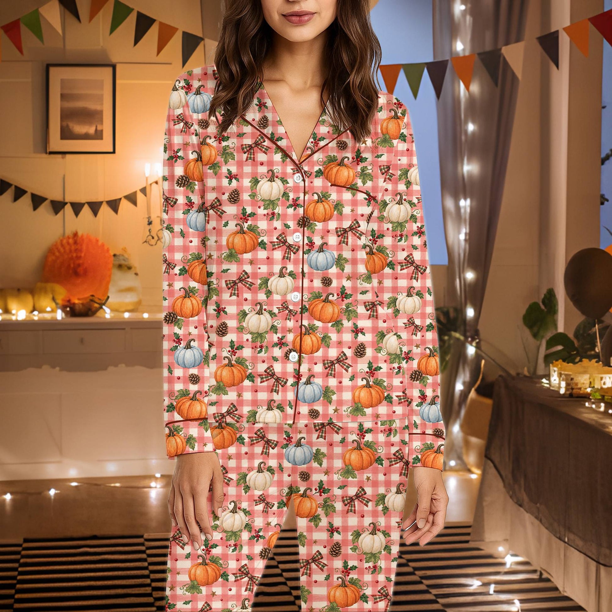 Detailed view of the orange pumpkins and pinecones on the pajama fabric