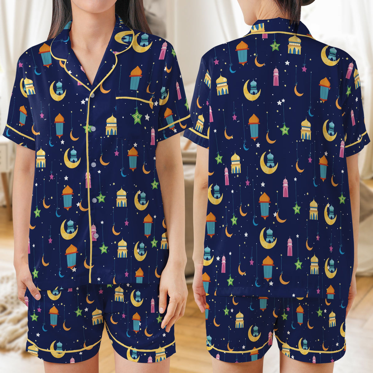Family wearing the navy blue Ramadan pajama set with hanging lanterns and crescents