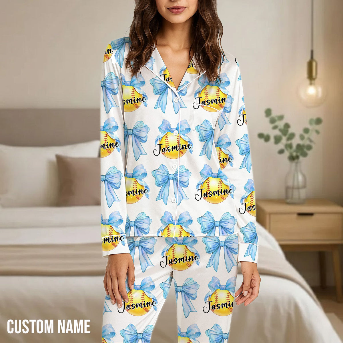 Detail view of the yellow softball and bow pattern on the pajama set.