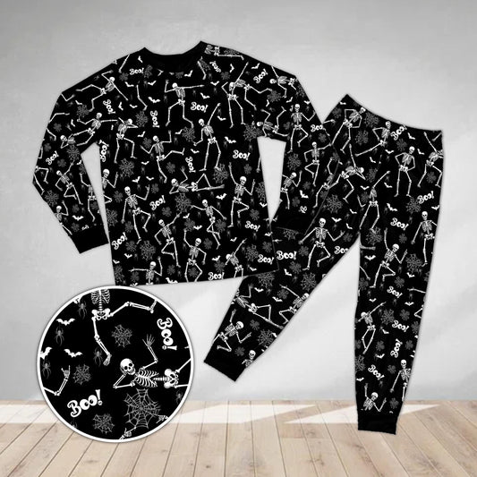 Main view of the spooky pajama set in black with dancing skeletons and bats print