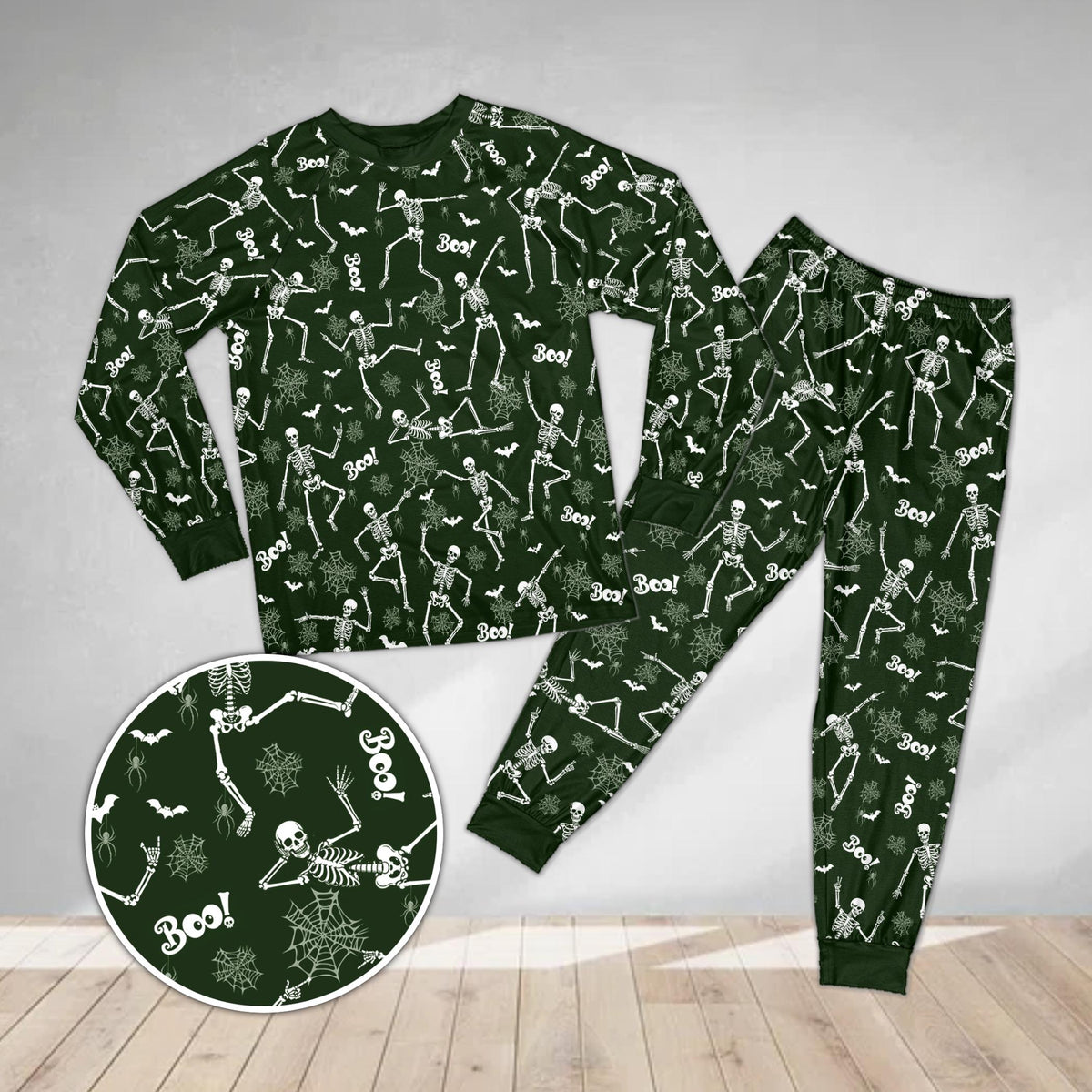 Front view of the spooky pajama set in green with playful spooky designs