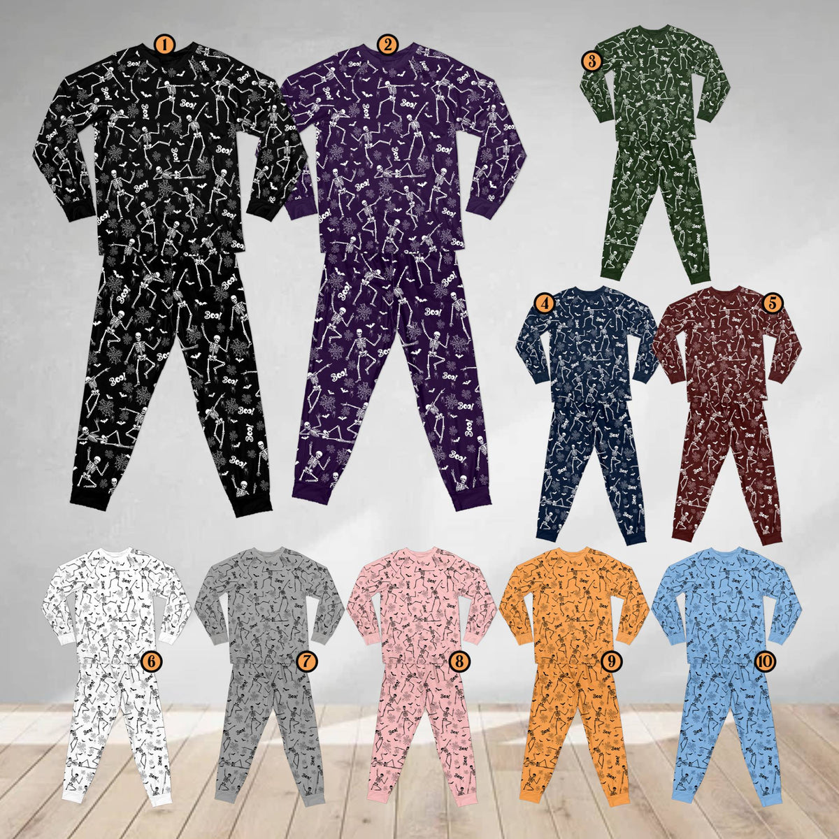 Front view of the spooky pajama set featuring multicolor print with skeletons and the word Boo