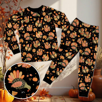 Thanksgiving pajama set in brown featuring autumn leaves and turkeys, front view