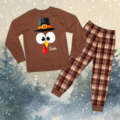 Personalized matching family pajamas featuring a Thanksgiving turkey and custom name and number, front view
