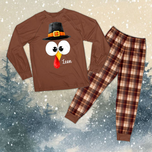 Personalized matching family pajamas featuring a Thanksgiving turkey and custom name and number, front view
