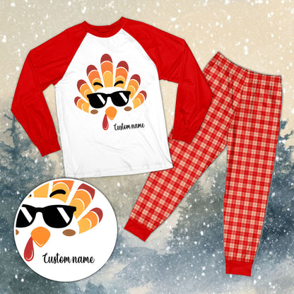 Personalized family matching pajamas xmas set featuring a white top with a cartoon turkey face and custom name, front view