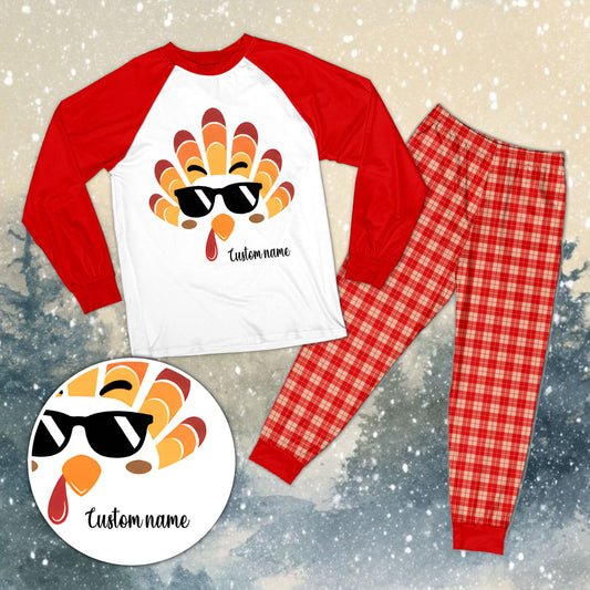 Personalized family matching pajamas xmas set featuring a white top with a cartoon turkey face and custom name, front view