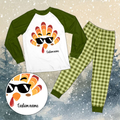 Family wearing personalized turkey pajama sets with green plaid pants in a lifestyle setting