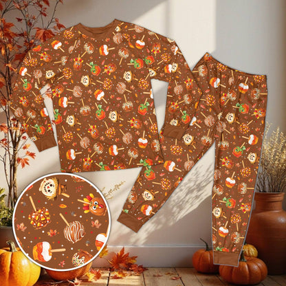 Multicolor matching holiday pajamas family set with Thanksgiving treats pattern, front view
