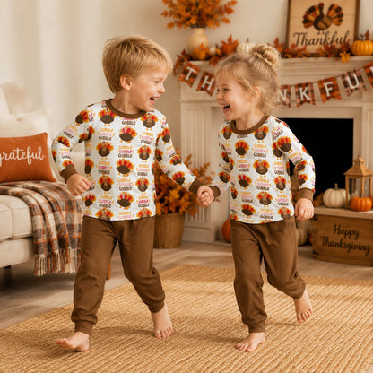 Lifestyle view of a family wearing the Thanksgiving pajama set