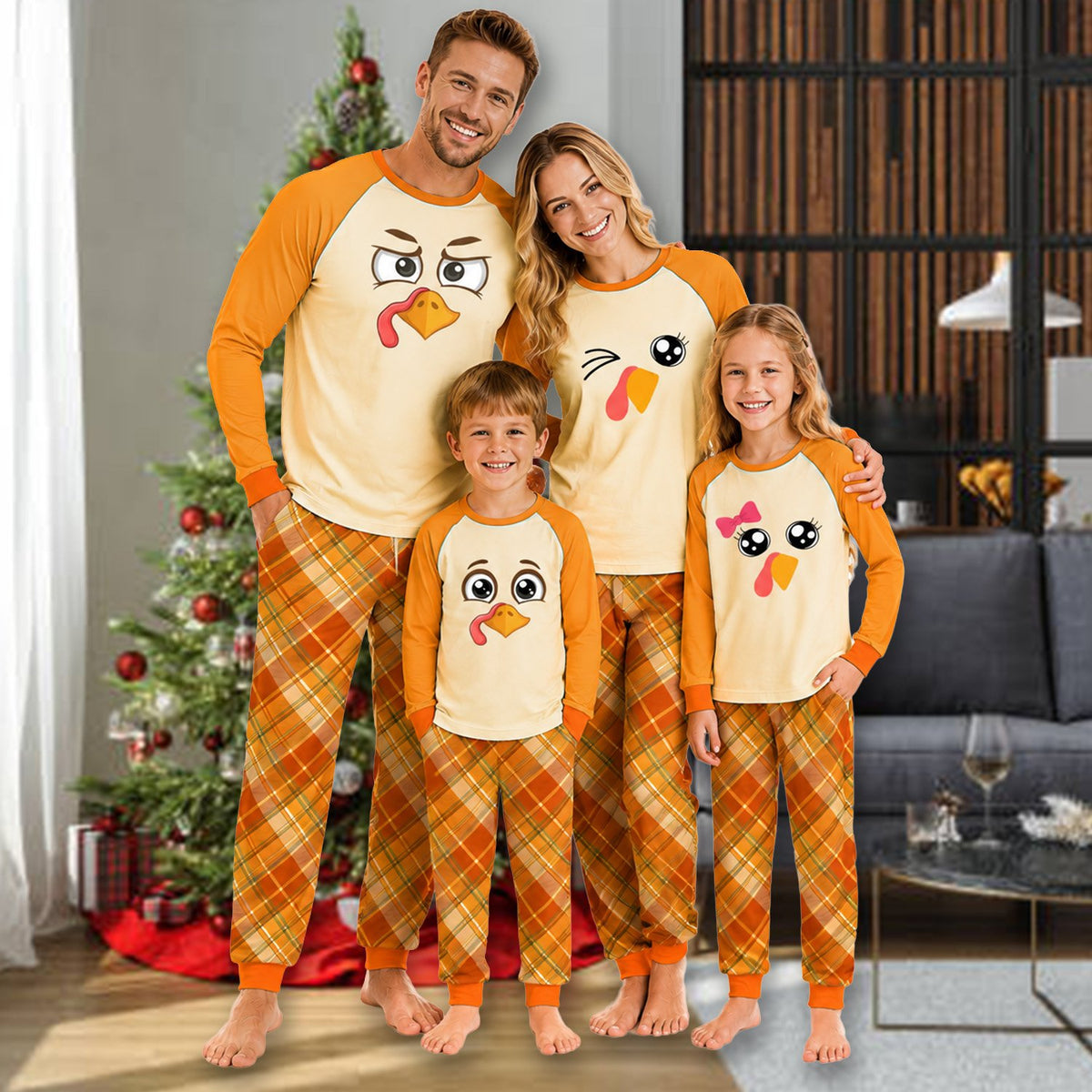Front view of a child's Thanksgiving pajama set featuring a turkey face and plaid pants