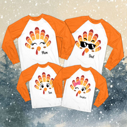 Family wearing personalized custom name Thanksgiving pajamas with orange plaid pants, lifestyle view