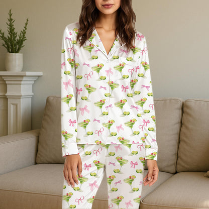 Lifestyle image of someone wearing the matching family pajamas with tropical drinks print