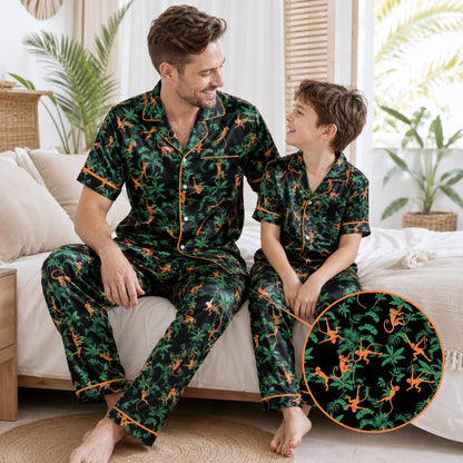 Adult lounging in matching family pajamas with vibrant tropical monkey print