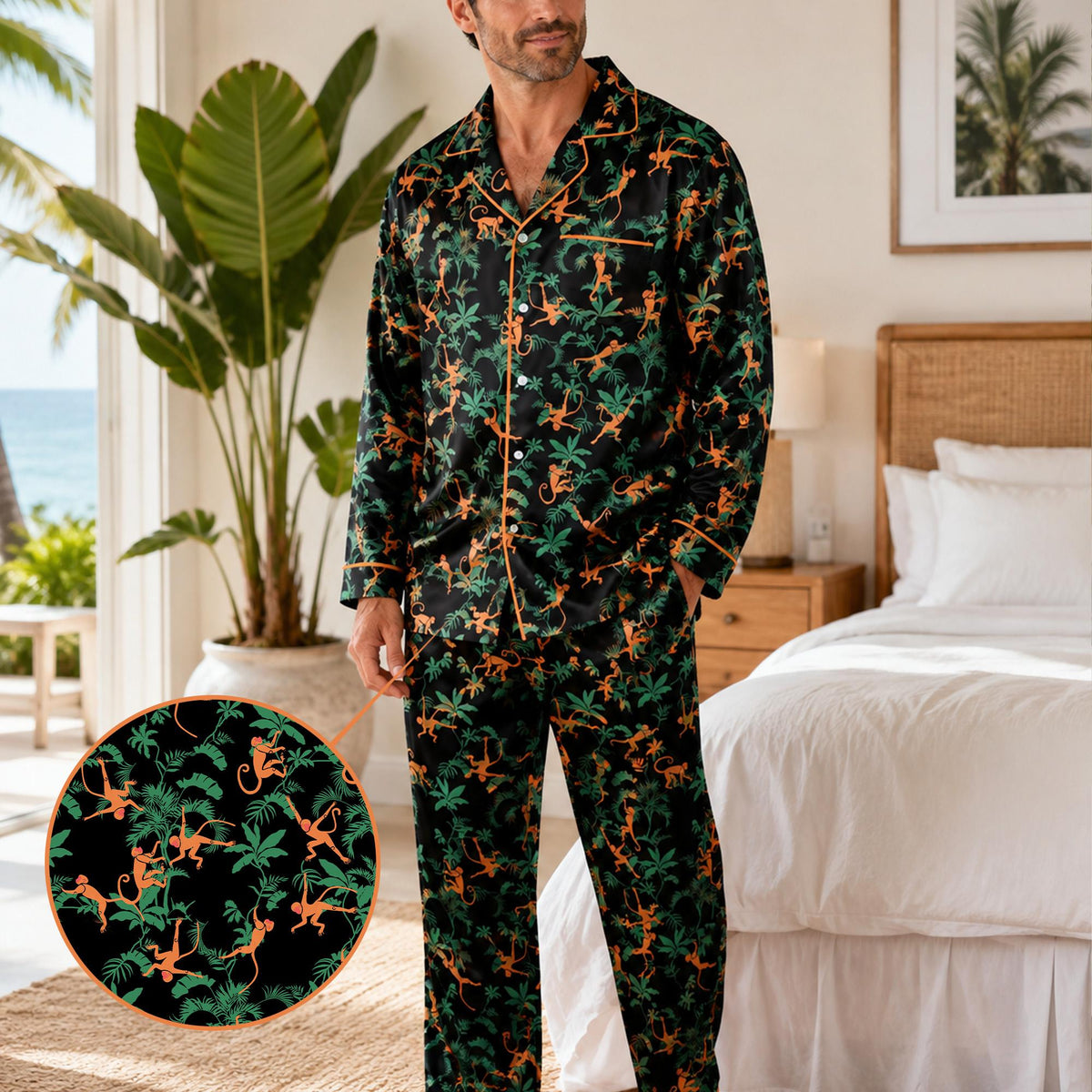 Relaxed adult posing in matching family pajamas with black and orange monkey pattern