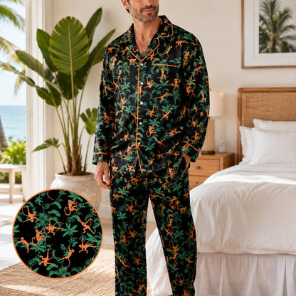 Relaxed adult posing in matching family pajamas with black and orange monkey pattern
